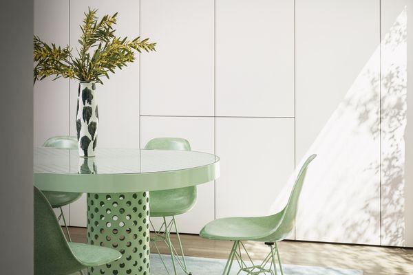 Light green furnishings with white cupboards in Chet Callahan’s house