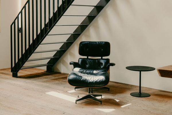 An Eames lounge chair and ottoman in a communal area in the Black Forest house