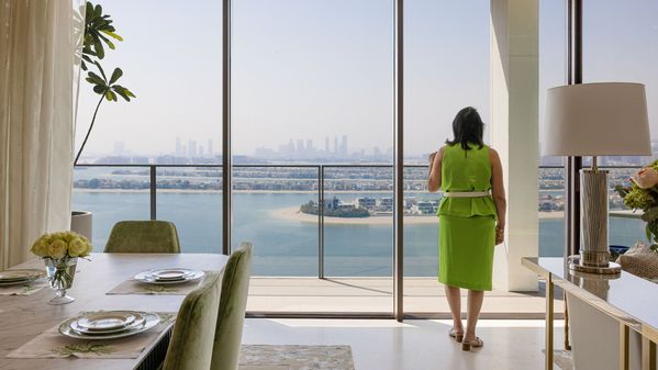 Tammy looking out of her apartment window in Palm Jumeirah, Dubai