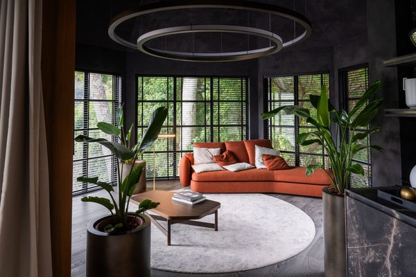 A wide angle photograph showing a dark and luxurious lounge area