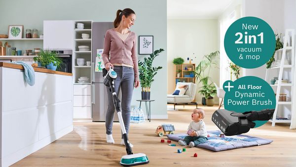 A person vacuuming and mopping a hard wood floor with a Bosch Unlimited 7 Aqua vacuum and mop