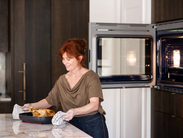 Candid photo of Jan cooking with her Gaggenau 400 oven