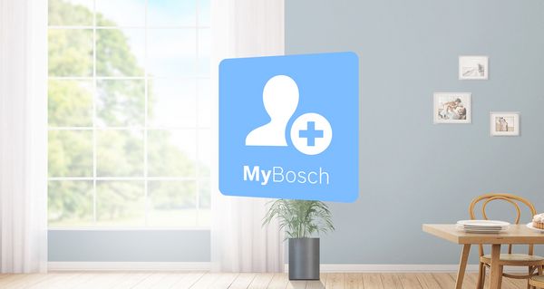 Tablet showing MyBosch icon is in foreground of a bright kitchen with Bosch home appliances. Green warranty icon on the left represents extended warranty options.