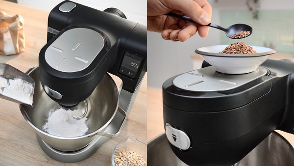 A person blends ingredients in a mixer, showcasing the process of preparing food with a modern kitchen appliance.  