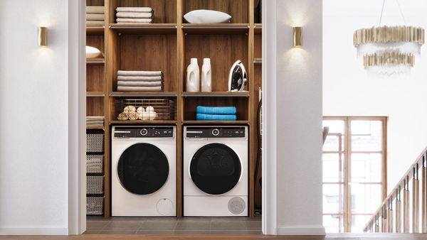 A tidy laundry room featuring a modern washer and dryer, organized for efficient laundry tasks.