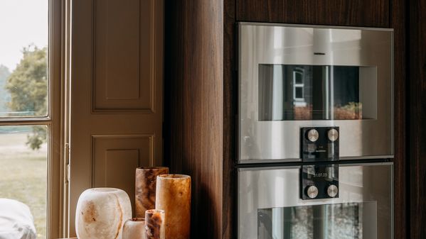 Gaggenau ovens integrated into beautiful walnut furniture