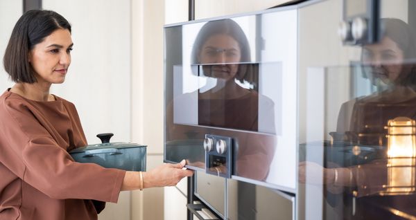 Summer Jensen opening the Gaggenau combi-steam oven. 