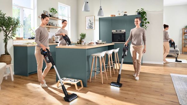 Person vacuuming multiple areas of the house in different ways