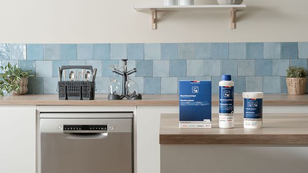 Cleaning accessories and spare parts presented on kitchen countertop