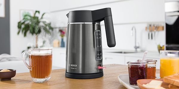 DesignLine, black kettle on countertop with a glass mug of tea