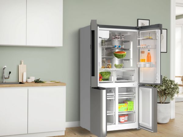 Large fridge freezer with all doors open showing interior