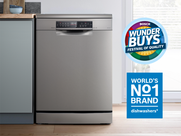 Stainless steel Bosch freestanding dishwasher beside cabinetry 