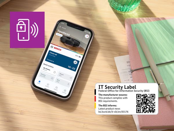 Smartphone auf dem Frühstückstisch zeigt die Spotless-Profilseite in der Bosch Home Connect App.