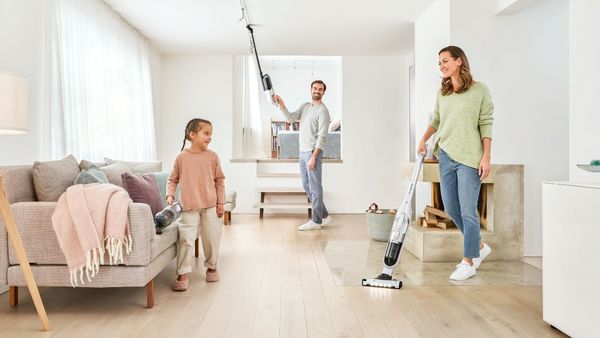 Family using multiple Bosch Vacuum Cleaners in living room