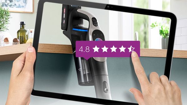 Electronic tablet with person leaving high star review on vacuum cleaner