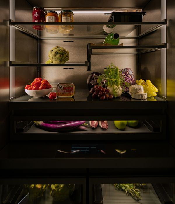 Close-up of the Vario cooling Expressive series appliance with colourful food lit with the appliances lights