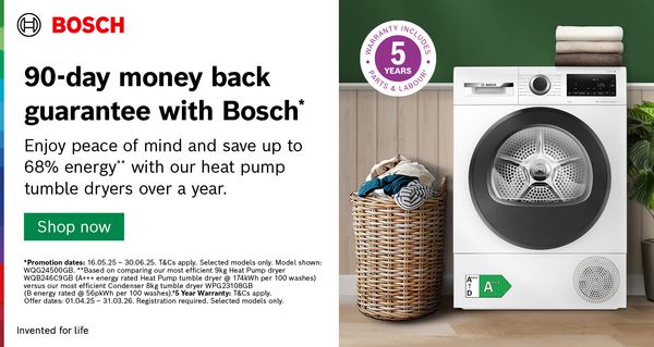 Bosch Heat Pump Tumble Dryer surrounded by clothes and a plant in wooden green room