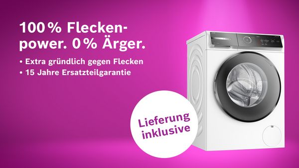 Waschmaschine vor lila Hintergrund mit Hinweis auf 100% Fleckenpower und Lieferung inklusive.