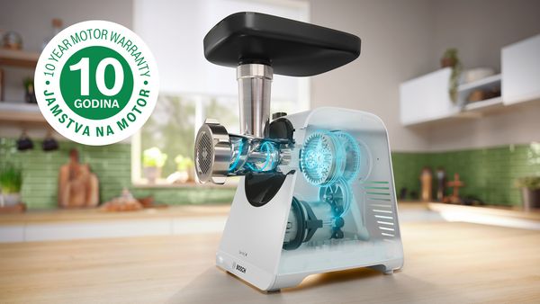 Bijeli uređaj za mljevenje serije 4 s rendgenskom slikom unutrašnjosti motora, pored logotipa za 10-godišnje jamstvo.