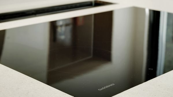 Close-up of a Gaggenau flex induction cooktop and Gaggenau 200 series table ventilation