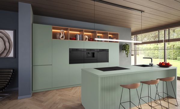 Groene keuken met keukentoestellen van de Bosch Matt Design-lijn.