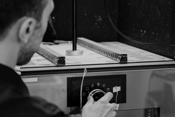 Reportage view at the Gaggenau Lipsheim factory of Thibaut Mittnacht and Alice Ortuani discussing the doors of the expressive oven
