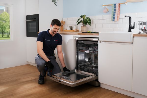 Bosch service engineer repairing a dishwasher