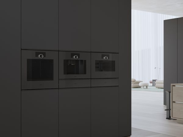 The Gaggenau Minimalistic series fully automatic coffee machine installed between other complimentary Minimalistic series appliances
