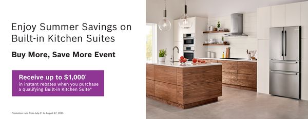Modern kitchen featuring built-in appliances, wooden cabinetry, and a stylish countertop with fresh produce.