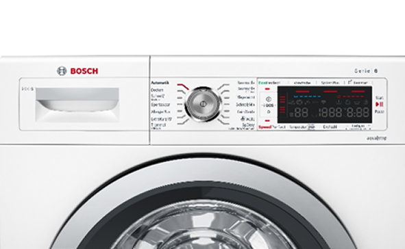 A close-up view of the control panel and upper part of a white Bosch front-load washing machine