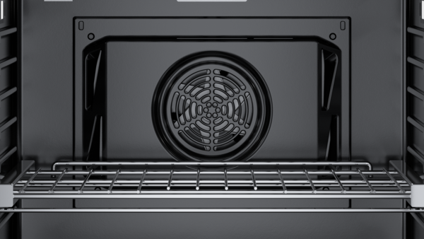 Interior view of a Bosch built-in compact oven with microwave function, showing the fan and heating element. 
