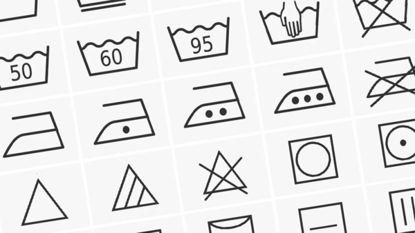 collection of laundry care symbols, including instructions for washing, drying, and ironing, along with associated temperature settings.
