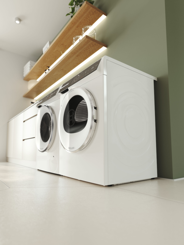 Ein Bosch Trockner unter einer Bosch Waschmaschine, an der Wand stehend.