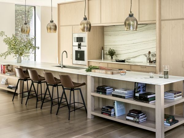 Lit beautifully by natural light from large windows, Sam Fertik’s home kitchen is open and welcoming. 