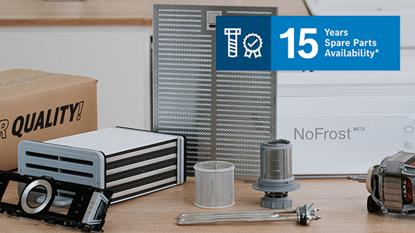 Different tools and spare parts on worktop with 15 Years Spare Parts icon