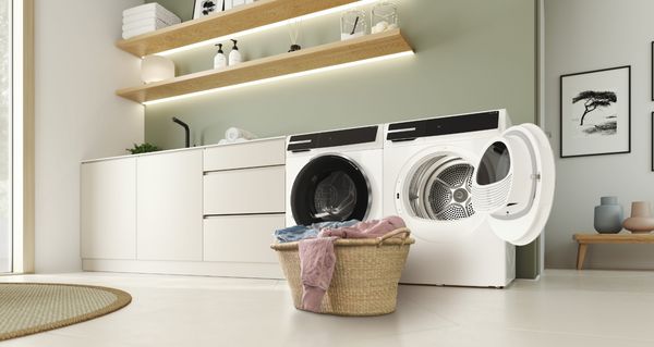       Een explosief overzicht van een Bosch wasdroger met de opnieuw ontworpen onderdelen gemarkeerd in het groen.     