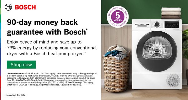 Bosch Heat Pump Tumble Dryer surrounded by clothes and a plant in wooden green room