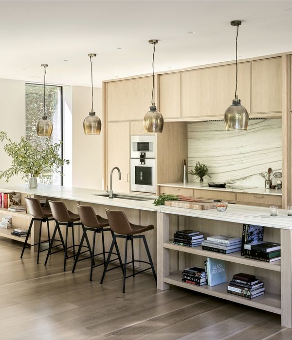 Lit beautifully by natural light from large windows, Sam Fertik’s home kitchen is open and welcoming. 