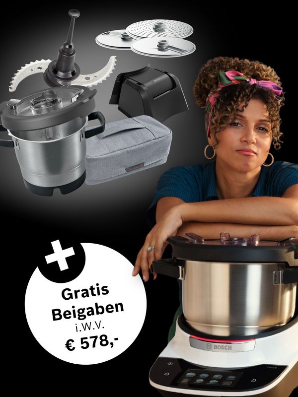 Ein modernes Küchengerät mit einem Edelstahl-Topf, umgeben von Küchenutensilien, einschließlich eines kabellosen Stabmixers und Aufbewahrungsbehältern.