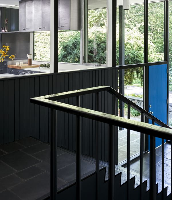 Interior view which shows the kitchen are and the front door with it&rsquo;s distinctive blue colour