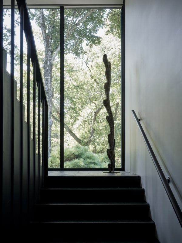 View up the stairs with its natural light via floor to ceiling glass