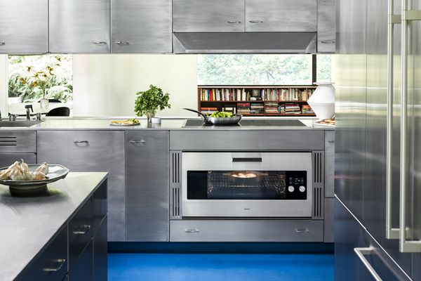 Kitchen view showing Gaggenau appliances that blend into the St. Charles steel kitchen cabinetry