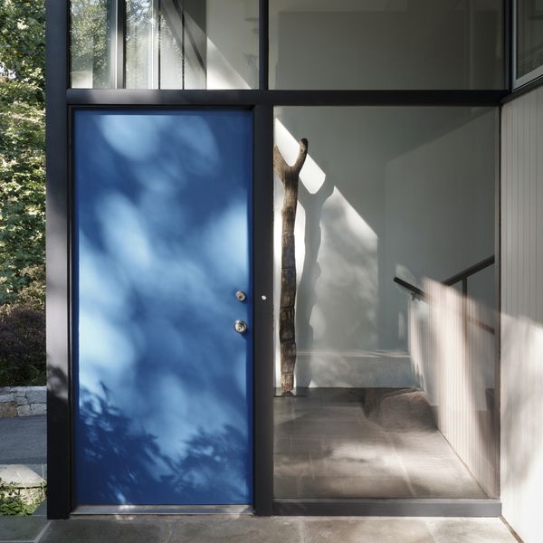 View of front door showing the distinctive blue colour that runs through the house.