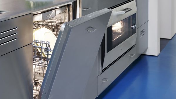 Close-up view of the Gaggenau dishwasher blending in with the St. Charles steel kitchen cabinetry