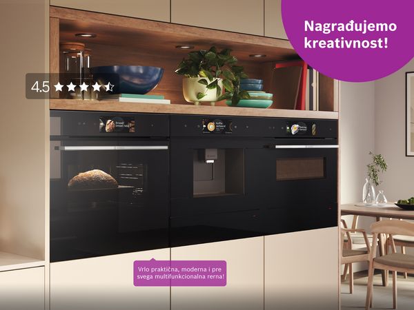 Muškarac i žena u kuhinji sa mašinom za pranje sudova, kuhinjskim aparatima i plavim ormarima.