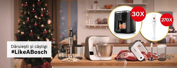 Electrocasnice mici pentru bucătărie Bosch pe un blat &icirc;ntr-o locuință decorată pentru sărbători de Crăciun