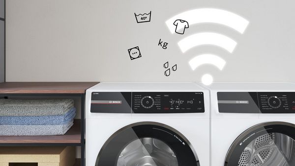 Bildet viser et Wi-Fi-ikon ved en vaskemaskin, for &aring; illustrere tr&aring;dl&oslash;s fjernstyring med Home Connect.