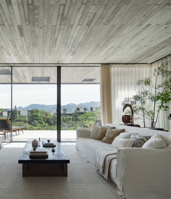 View from the lounge, out to the balcony and the mountains beyond