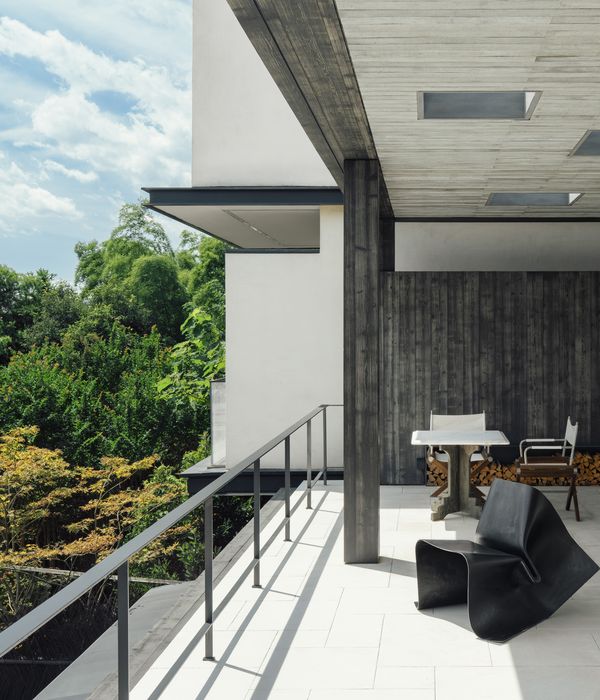 Seating on the balcony overlooking the green lush mountains