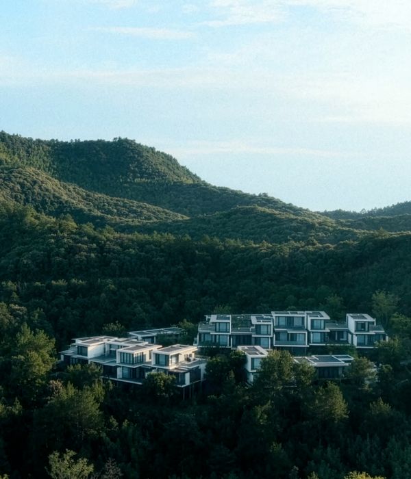 The tree top level design oasis surrounded by lush green mountains